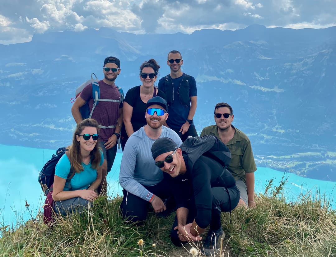 WEDO employees drinking beer on a mountain