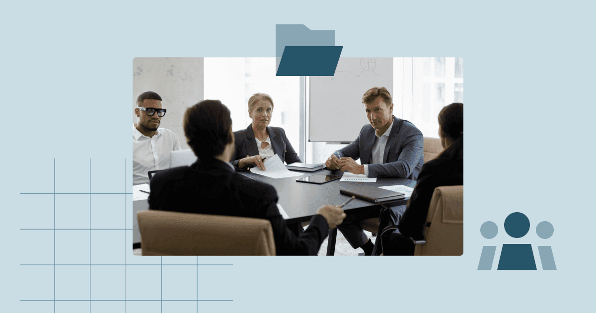 Executive team gathered around a conference table during a management committee meeting.