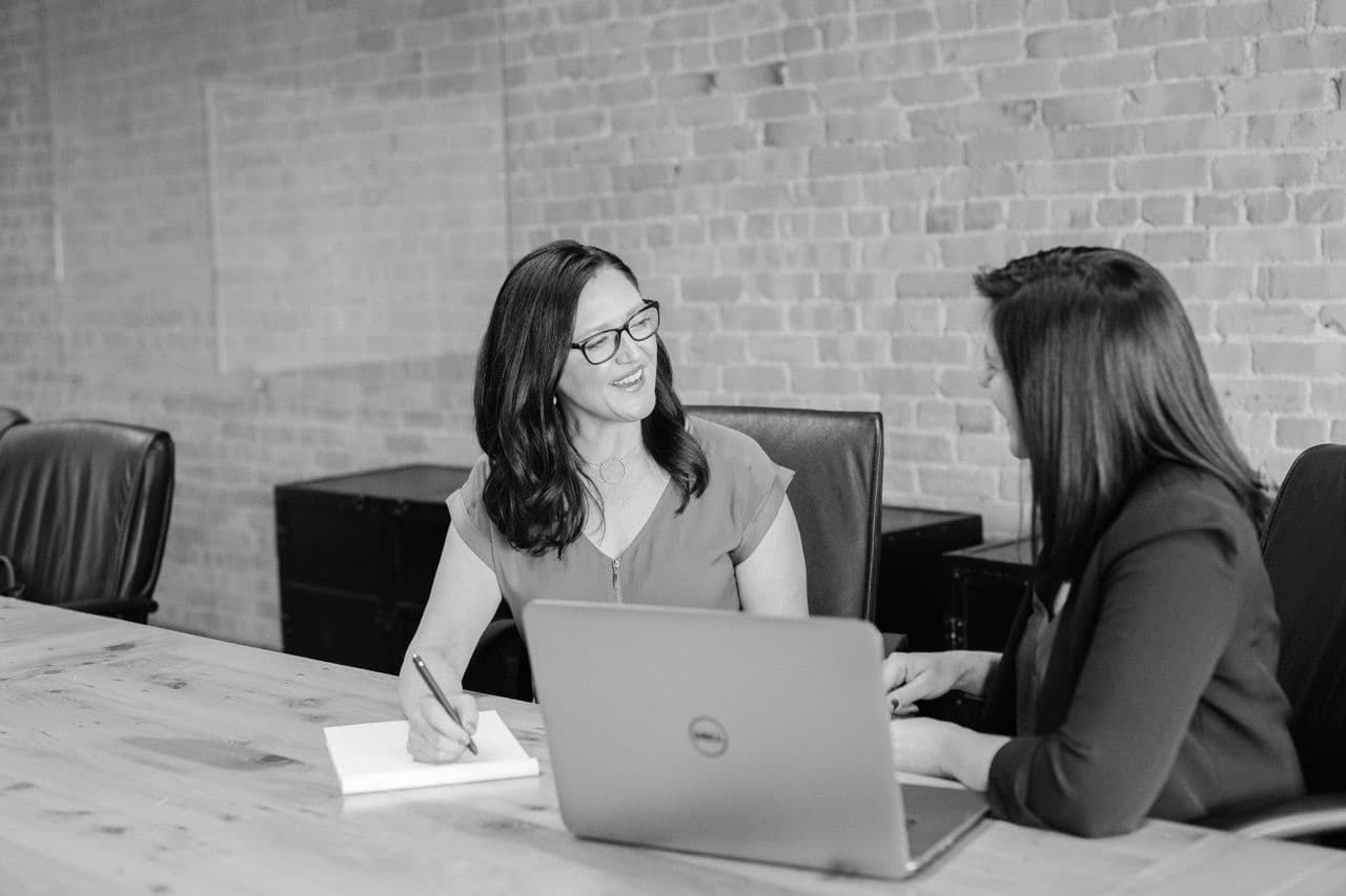 two women discussing about business topics